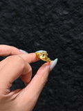 Golden citrine solitaire ring with 18K gold plated setting, close-up
