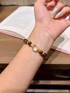 Retro brown-gold bracelet worn on a wrist
