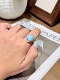 Caribbean larimar halo ring with 18K gold plated setting worn on a finger