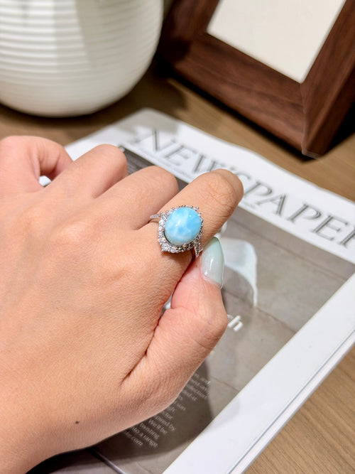 Caribbean larimar halo ring with 18K gold plated setting worn on a finger
