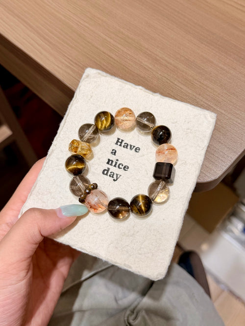 Multi-gemstone bracelet with golden tiger's eye and smoky quartz on a card