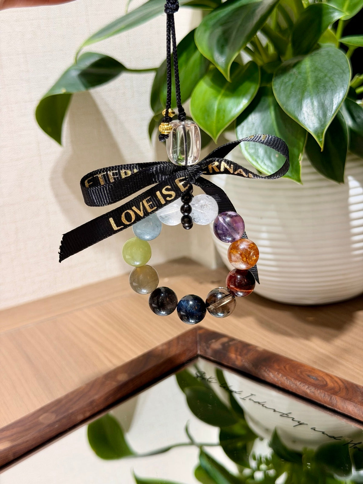 Colorful multi-gemstone crystal car charm with black ribbon bow
