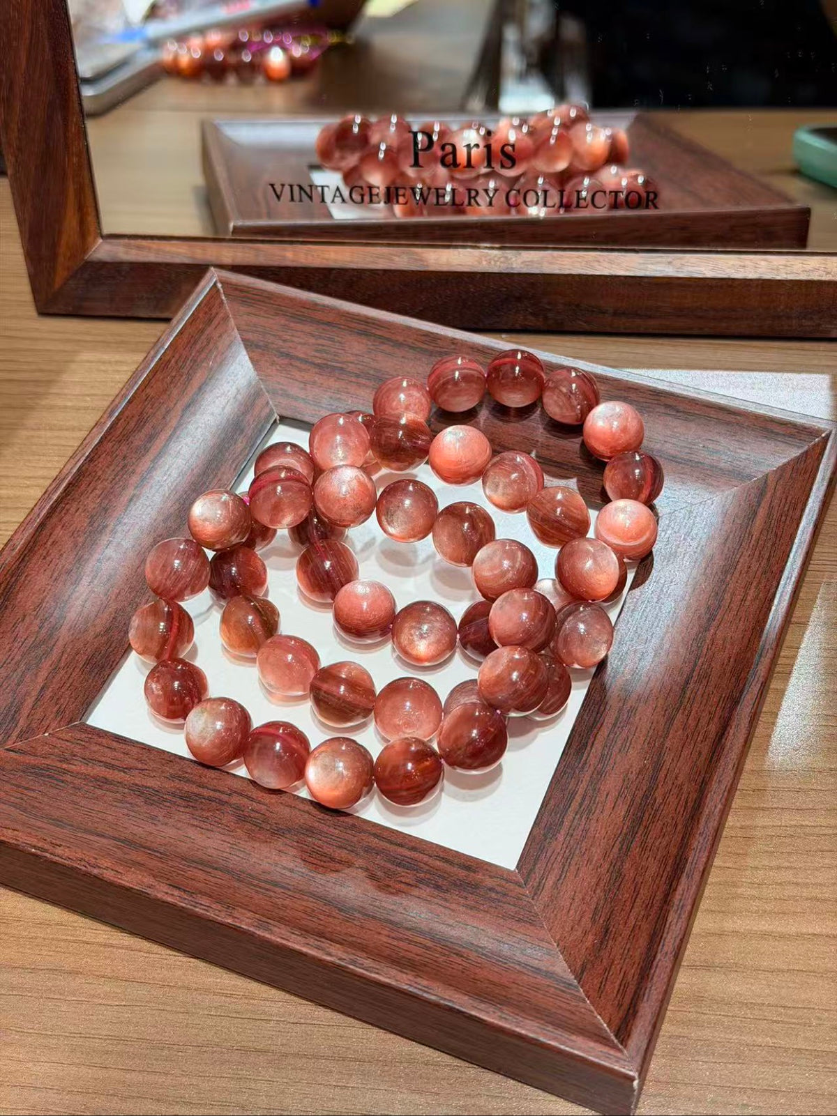 Pink Lepidolite Bracelet coiled in a wooden tray, large pink beads