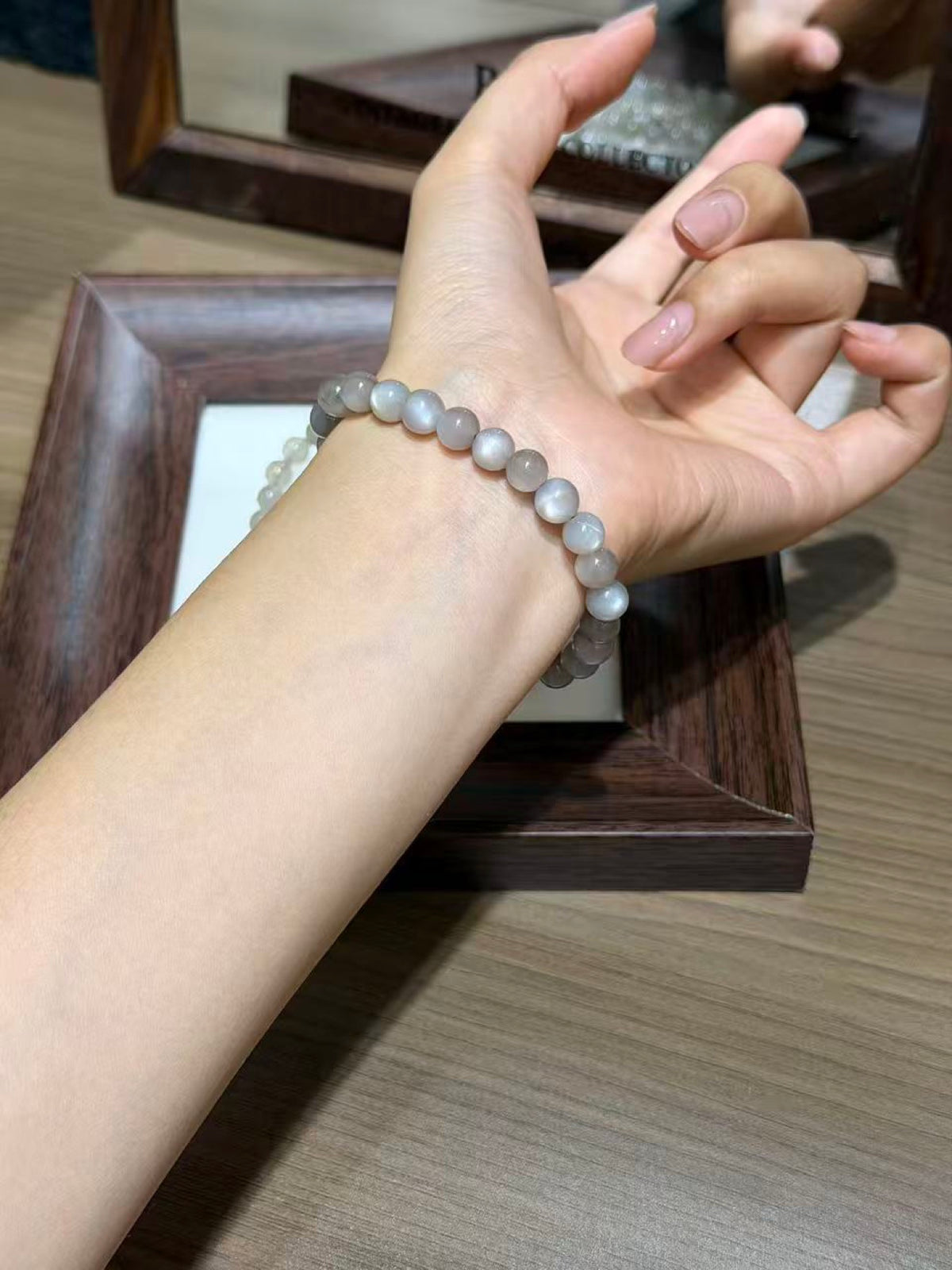 Silver Moonlight Bracelet Set worn on wrist, glowing silver moonstone beads