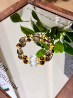 Coffee-gold crystal bracelet on a mirror